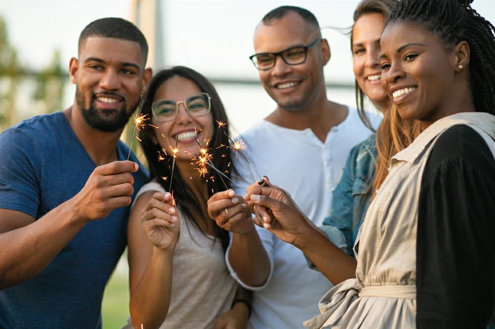 Friends with sparklers at a celebration